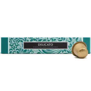 Delicato coffee capsules box with one gold Nespresso-compatible capsule, teal floral packaging, 10 capsules per box